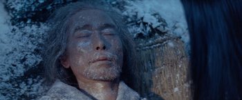Movie still from “Kwaidan” (1964), directed by Masaki Kobayashi – A man with his face covered in snow; Close Up shot, High angle