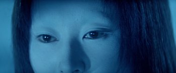 Movie still from “Kwaidan” (1964), directed by Masaki Kobayashi – A woman's eyes in a blue light; Extreme Close Up shot, Overhead angle