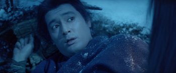 Movie still from “Kwaidan” (1964), directed by Masaki Kobayashi – A person laying on the ground; Close Up shot, High angle