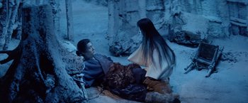 Movie still from “Kwaidan” (1964), directed by Masaki Kobayashi – A man and a woman sitting on the ground; Wide shot, High angle