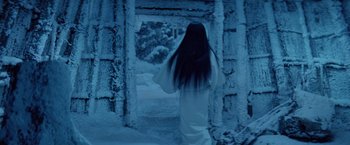 Movie still from “Kwaidan” (1964), directed by Masaki Kobayashi – A woman dressed in white walking through a snow covered forest; Medium shot, Over the shoulder angle