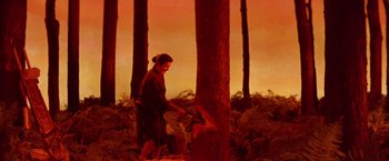 Movie still from “Kwaidan” (1964), directed by Masaki Kobayashi – A person cutting a tree with an electric saw; Wide shot, Low angle