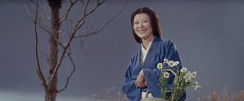 Movie still from “Kwaidan” (1964), directed by Masaki Kobayashi – A woman in a blue robe standing next to a tree; Medium shot, Low angle