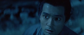 Movie still from “Kwaidan” (1964), directed by Masaki Kobayashi – A man's face in the dark; Close Up shot, High angle