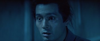 Movie still from “Kwaidan” (1964), directed by Masaki Kobayashi – A man's face in a dark room; Close Up shot, Low angle