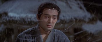 Movie still from “Kwaidan” (1964), directed by Masaki Kobayashi – A man in a robe looking out of a window; Close Up shot, Low angle