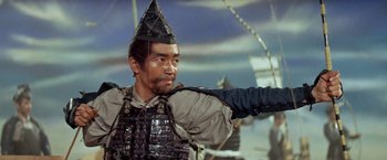 Movie still from “Kwaidan” (1964), directed by Masaki Kobayashi – A man wearing a hat and a body armor; Close Up shot, Low angle