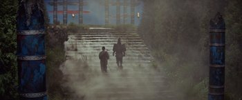 Movie still from “Kwaidan” (1964), directed by Masaki Kobayashi – Two people walking up a set of stairs in the fog; Wide shot, Low angle