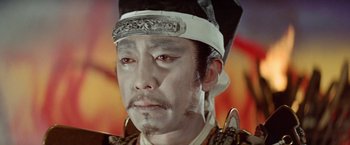 Movie still from “Kwaidan” (1964), directed by Masaki Kobayashi – A person wearing a hat; Close Up shot, Low angle