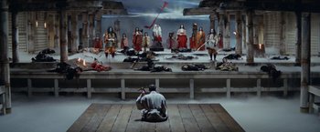 Movie still from “Kwaidan” (1964), directed by Masaki Kobayashi – A scene of a theater with a man playing a flute; Extreme Wide shot, High angle