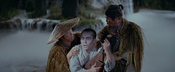 Movie still from “Kwaidan” (1964), directed by Masaki Kobayashi – A group of men standing next to each other holding instruments; Medium shot, High angle