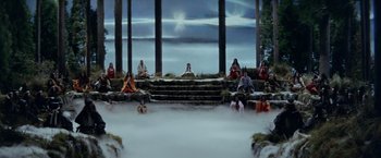 Movie still from “Kwaidan” (1964), directed by Masaki Kobayashi – A group of people sitting on steps in the middle of the night; Extreme Wide shot, High angle