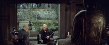 Movie still from “Kwaidan” (1964), directed by Masaki Kobayashi – An older man sitting in front of a window; Wide shot, Over the shoulder angle