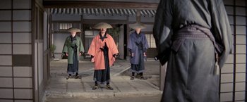Movie still from “Kwaidan” (1964), directed by Masaki Kobayashi – A group of people in traditional asian clothing; Wide shot, Low angle