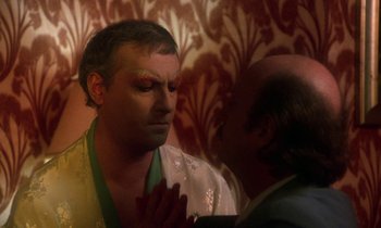 Movie still from “La Cage aux Folles” (1978), directed by Édouard Molinaro – A man in a white shirt is looking at another man in a white shirt; Close Up shot, Over the shoulder angle