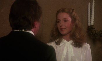 Movie still from “La Cage aux Folles” (1978), directed by Édouard Molinaro – A young girl in a white shirt is talking to an older man; Close Up shot, Over the shoulder angle