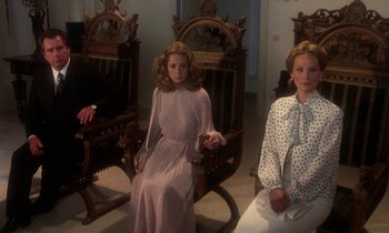 Movie still from “La Cage aux Folles” (1978), directed by Édouard Molinaro – Two women sitting in chairs in a living room; Medium shot, High angle
