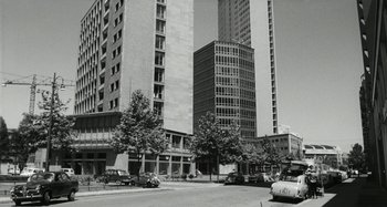 Movie still from “La Notte” (1961), directed by Michelangelo Antonioni – A black - and - white photo of a city street; Extreme Wide shot, Low angle