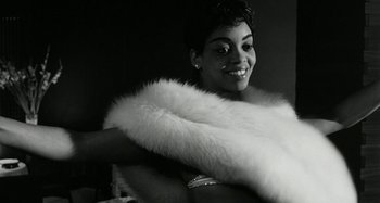 Movie still from “La Notte” (1961), directed by Michelangelo Antonioni – A black and white photo of a woman wearing a fur stole; Close Up shot, Low angle