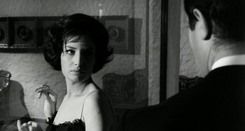 Movie still from “La Notte” (1961), directed by Michelangelo Antonioni – A black - and - white photo of a woman in front of a mirror; Close Up shot, Over the shoulder angle