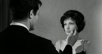 Movie still from “La Notte” (1961), directed by Michelangelo Antonioni – A man and a woman looking at each other; Close Up shot, Over the shoulder angle