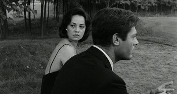 Movie still from “La Notte” (1961), directed by Michelangelo Antonioni – A man and a woman standing next to each other; Close Up shot, Over the shoulder angle