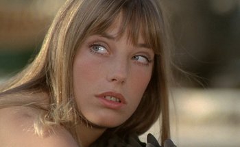 Movie still from “The Swimming Pool” (1969), directed by Jacques Deray – A woman's eyes and face; Close Up shot, Low angle