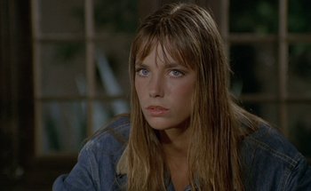 Movie still from “The Swimming Pool” (1969), directed by Jacques Deray – A person with long hair; Close Up shot, Over the shoulder angle