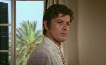 Movie still from “The Swimming Pool” (1969), directed by Jacques Deray – A person wearing a plaid shirt; Close Up shot, Low angle