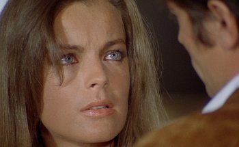 Movie still from “The Swimming Pool” (1969), directed by Jacques Deray – A person with blue eyes; Close Up shot, Over the shoulder angle