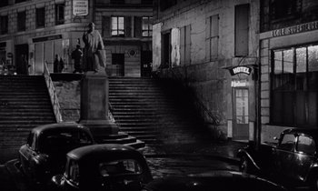 Movie still from “The Truth” (1960), directed by Henri-Georges Clouzot – An image of a street scene in the night time; Extreme Wide shot, High angle