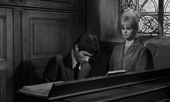 Movie still from “The Truth” (1960), directed by Henri-Georges Clouzot – A man and a woman sitting at a piano together; Medium shot, High angle