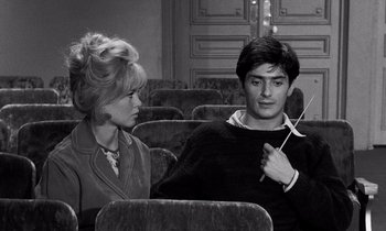 Movie still from “The Truth” (1960), directed by Henri-Georges Clouzot – A man and a woman sitting in a movie theater; Medium shot, Over the shoulder angle