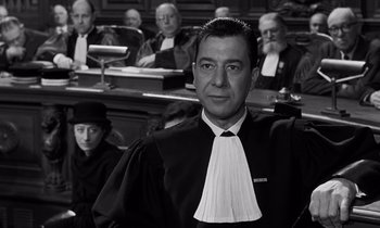 Movie still from “The Truth” (1960), directed by Henri-Georges Clouzot – A man in a court room wearing a judge's robe; Close Up shot, Low angle