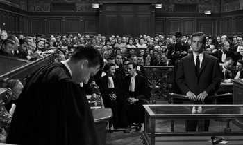 Movie still from “The Truth” (1960), directed by Henri-Georges Clouzot – A black and white photo of a crowd of people in a courtroom; Wide shot, High angle