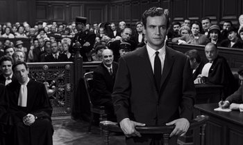 Movie still from “The Truth” (1960), directed by Henri-Georges Clouzot – A black and white photo of a man in a courtroom; Medium shot, Low angle