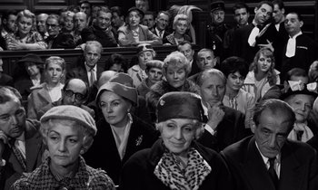 Movie still from “The Truth” (1960), directed by Henri-Georges Clouzot – A group of people sitting in front of each other; Medium shot, High angle