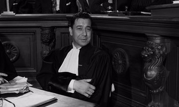 Movie still from “The Truth” (1960), directed by Henri-Georges Clouzot – A man sitting in front of a judge's bench; Medium shot, Low angle