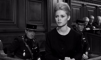 Movie still from “The Truth” (1960), directed by Henri-Georges Clouzot – A black and white photo of a woman and a man in a courtroom; Medium shot, Low angle