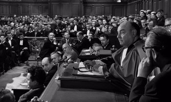 Movie still from “The Truth” (1960), directed by Henri-Georges Clouzot – A black - and - white photo of people in a courtroom; Medium shot, High angle
