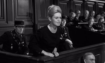Movie still from “The Truth” (1960), directed by Henri-Georges Clouzot – A black and white photo of a woman sitting in a courtroom; Close Up shot, Low angle