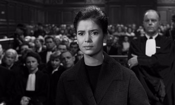 Movie still from “The Truth” (1960), directed by Henri-Georges Clouzot – A black and white photo of a woman in a courtroom; Medium shot, Low angle