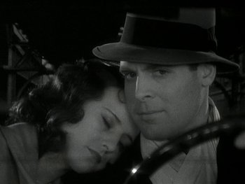 Movie still from “Ladies of Leisure” (1930), directed by Frank Capra – A man and a woman are sitting together in a car; Close Up shot, Low angle