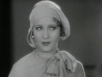 Movie still from “Ladies of Leisure” (1930), directed by Frank Capra – An old photo of a woman wearing a hat; Close Up shot, High angle