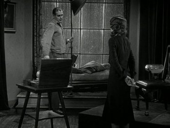 Movie still from “Ladies of Leisure” (1930), directed by Frank Capra – A man and a woman are in a room; Wide shot, High angle