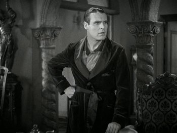 Movie still from “Ladies of Leisure” (1930), directed by Frank Capra – A black and white photo of a man in a dressing gown; Medium shot, High angle