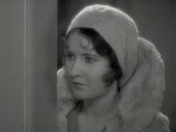 Movie still from “Ladies of Leisure” (1930), directed by Frank Capra – An old photo of a woman wearing a hat; Close Up shot, High angle
