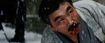 Movie still from “Lady Snowblood” (1973), directed by Toshiya Fujita – A person with a mustache; Close Up shot, Low angle