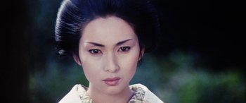 Movie still from “Lady Snowblood” (1973), directed by Toshiya Fujita – A person wearing a dress; Close Up shot, High angle
