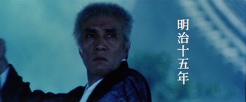 Movie still from “Lady Snowblood” (1973), directed by Toshiya Fujita – A person wearing a jacket; Close Up shot, Low angle